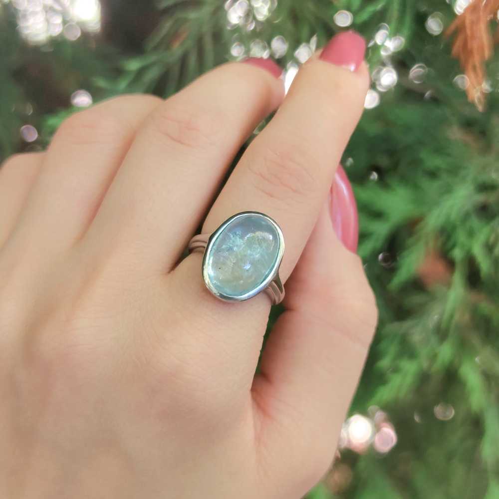 Three Stone Round Swiss Blue Topaz Ring with Diamond Accents | Angara